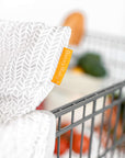 Baby Shopping Cart Cover - Little Arrows Design - Binxy tag on secured cart cover
